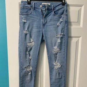 High waisted distressed jeans